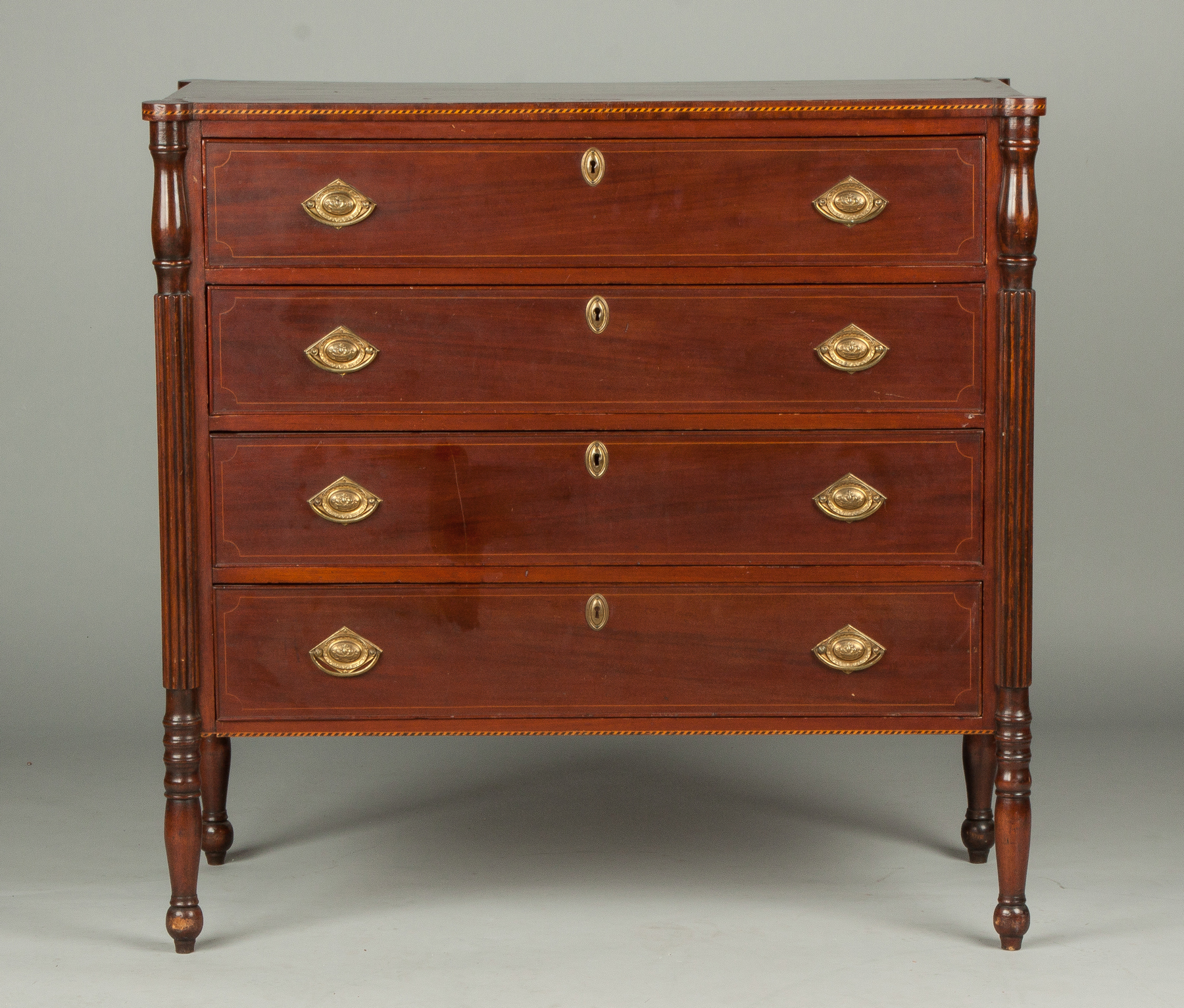 Appraisal: Sheraton Inlaid Mahogany Chest C Cookie cut ends fluted legs