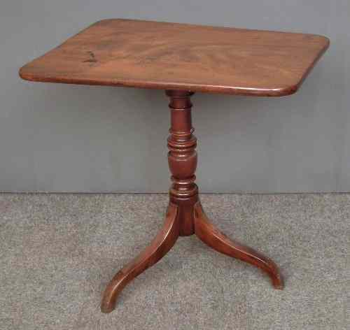 Appraisal: A late Georgian mahogany rectangular tripod table on turned column