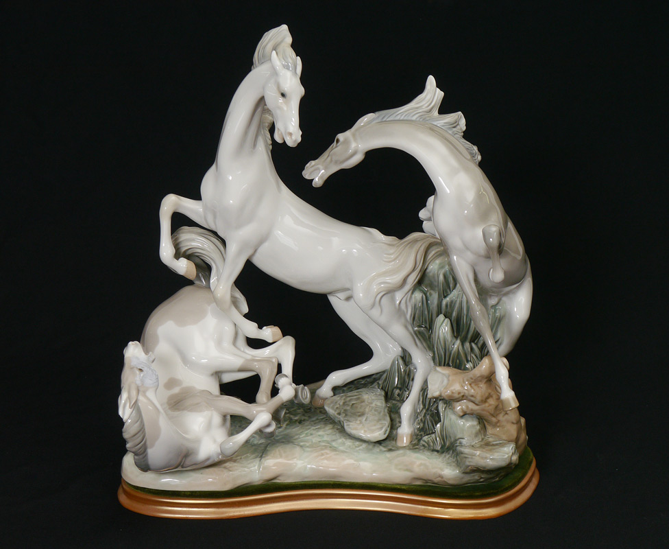 Appraisal: LLADRO PORCELAIN FIGURINE HORSE'S GROUP Fulgencio Garcia sculptor issued retired