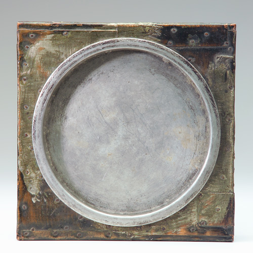 Appraisal: PAUL EVANS Large ashtray with riveted metal patchwork covering in