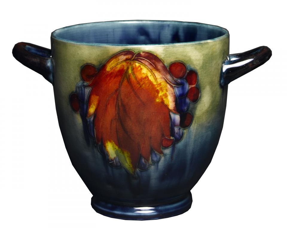 Appraisal: A MOORCROFT LEAF-AND-BERRY VASE DESIGNED BY WILLIAM MOORCROFT of Krater