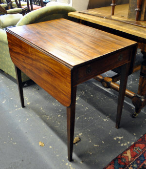 Appraisal: A th century mahogany Pembroke table with short round edged