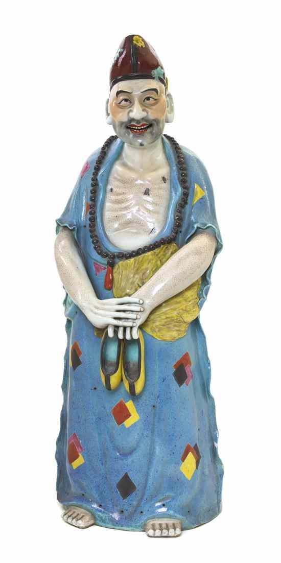 Appraisal: A Large Chinese Porcelain Model of an Immortal the figure