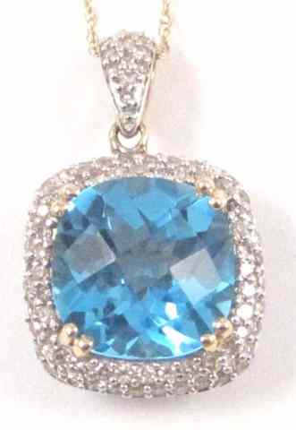 Appraisal: BLUE TOPAZ AND DIAMOND PENDANT NECKLACE suspended on a k