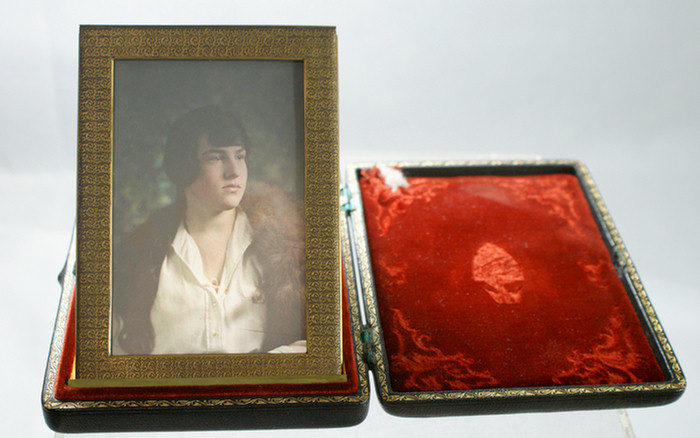 Appraisal: Unusual leather folding frame with a translucent portrait of a