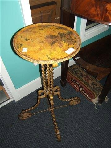 Appraisal: An antique gold painted wrought iron jardiniere stand with circular