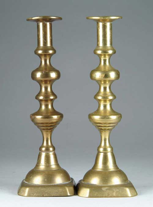 Appraisal: PAIR OF TALL BRASS CANDLESTICKS Turned shaft with cut corner