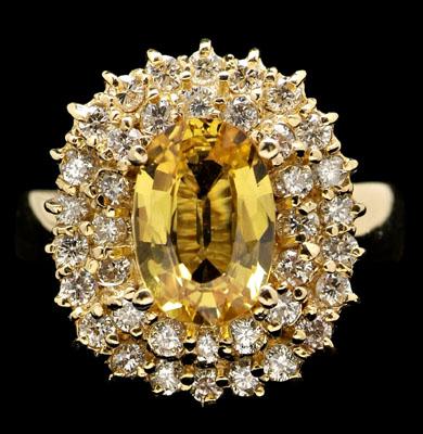 Appraisal: Golden sapphire diamond ring central oval golden yellow sapphire estimated