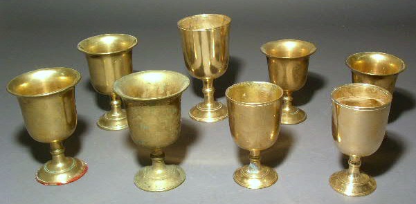 Appraisal: Eight brass goblets - high