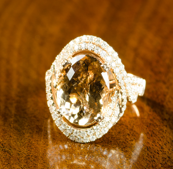 Appraisal: FOURTEEN KARAT ROSE GOLD MORGANITE AND DIAMOND RING ct oval