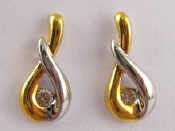 Appraisal: A pair of two coloured carat gold diamond earings approx