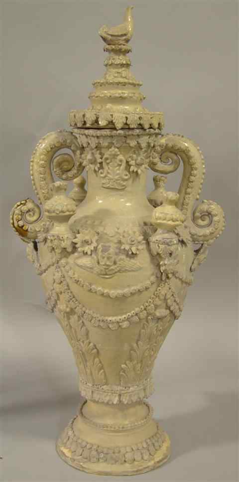 Appraisal: FRENCH PROVINCIAL GLAZED-TERRA COTTA URN WITH SPIGOT elaborately decorated urn