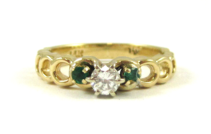 Appraisal: DIAMOND EMERALD AND FOURTEEN KARAT GOLD RING with two round-cut