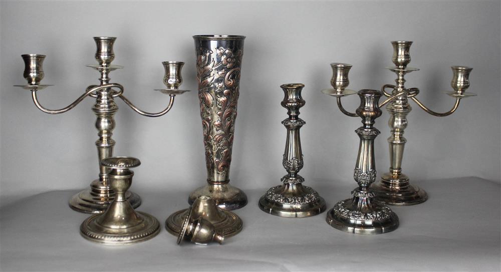 Appraisal: PAIR OF WEIGHTED SILVER CANDELABRA with three lights on knopped