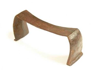 Appraisal: A Tongan headrest raised on triangular feet to curved supports