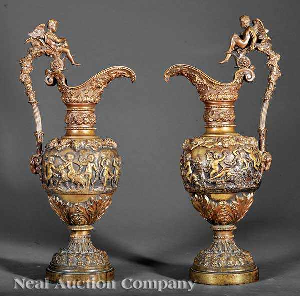 Appraisal: A Pair of Continental Patinated Bronze Figural Ewers mid- th