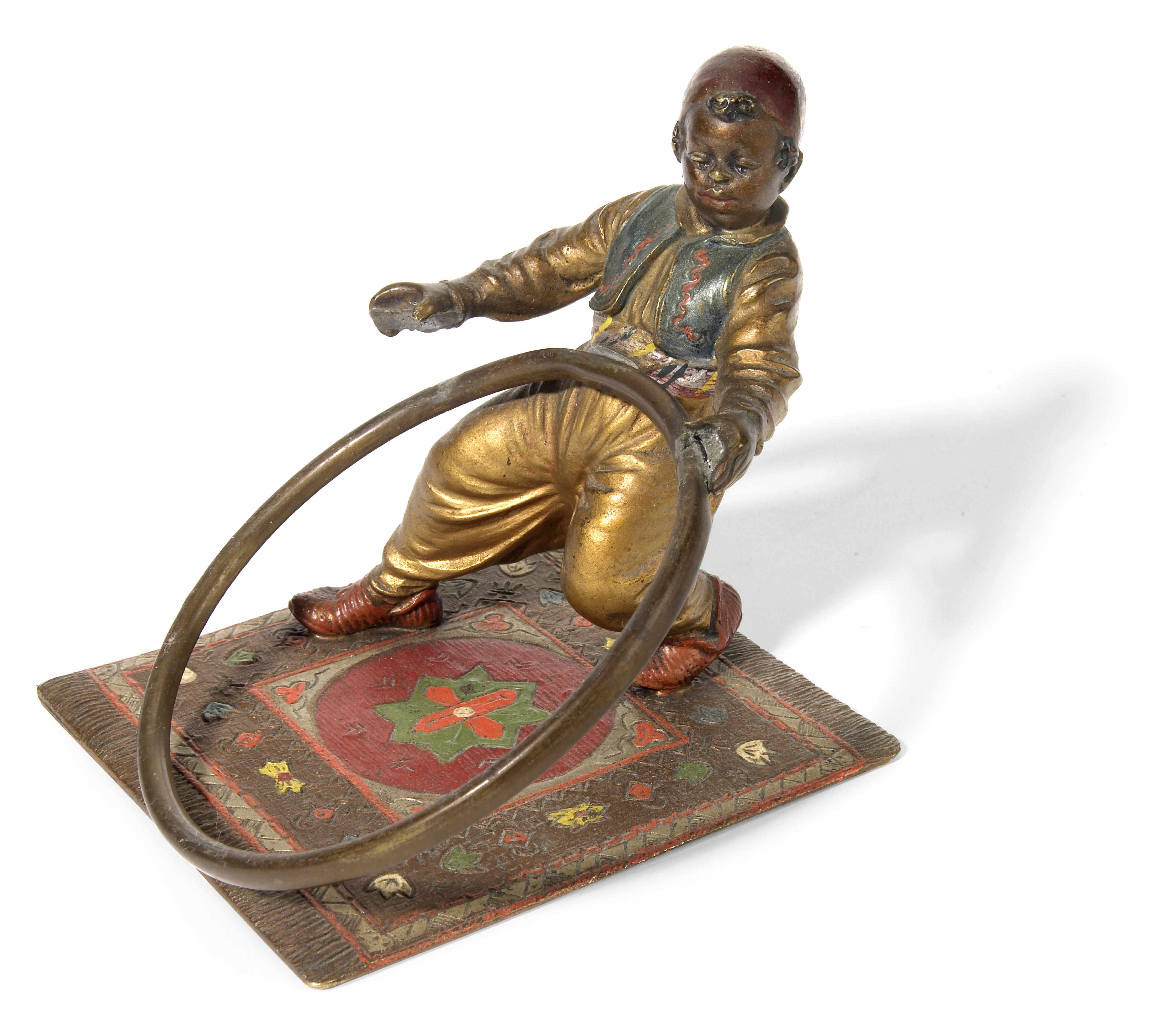 Appraisal: An Austrian cold painted bronze figure of an Arab boy