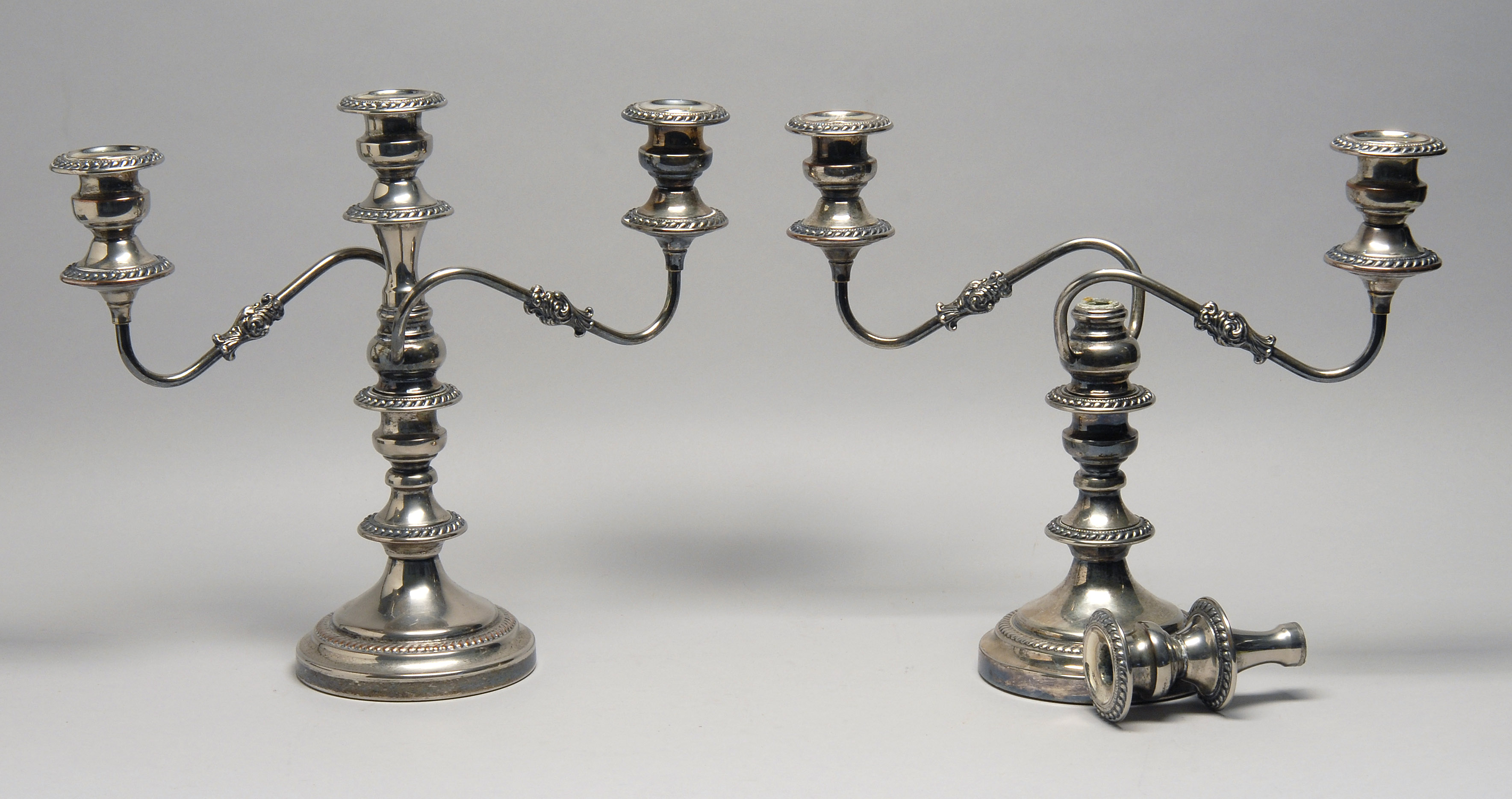 Appraisal: PAIR OF ENGLISH SILVER MFG CORP GEORGIAN-STYLE SILVER PLATED THREE-LIGHT