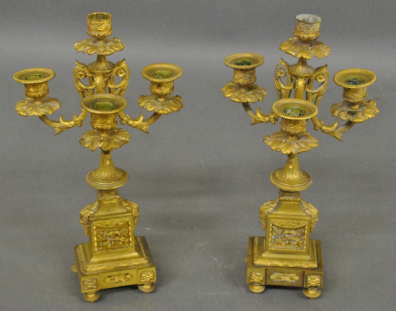 Appraisal: - Pair of French fire gilt brass candelabras decorated with