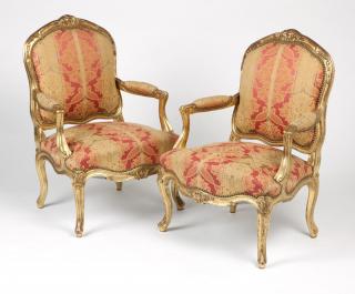 Appraisal: A pair of French giltwood fauteuils th century the foliate