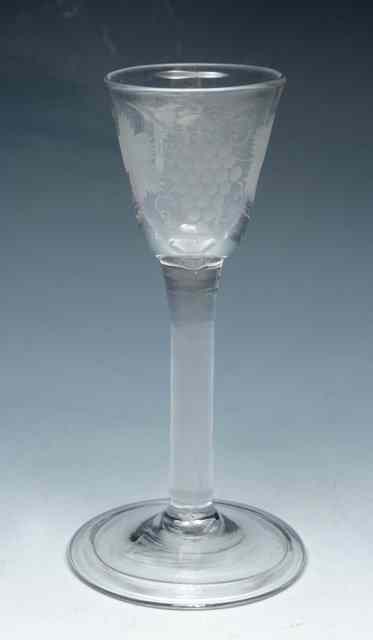 Appraisal: A PLAIN STEM WINE GLASS funnel bowl engraved with fruiting