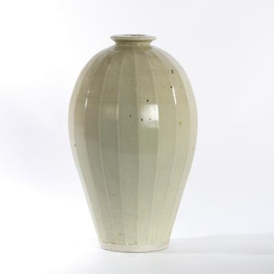 Appraisal: William 'Bill' Marshall British - a facetted ovoid stoneware vase