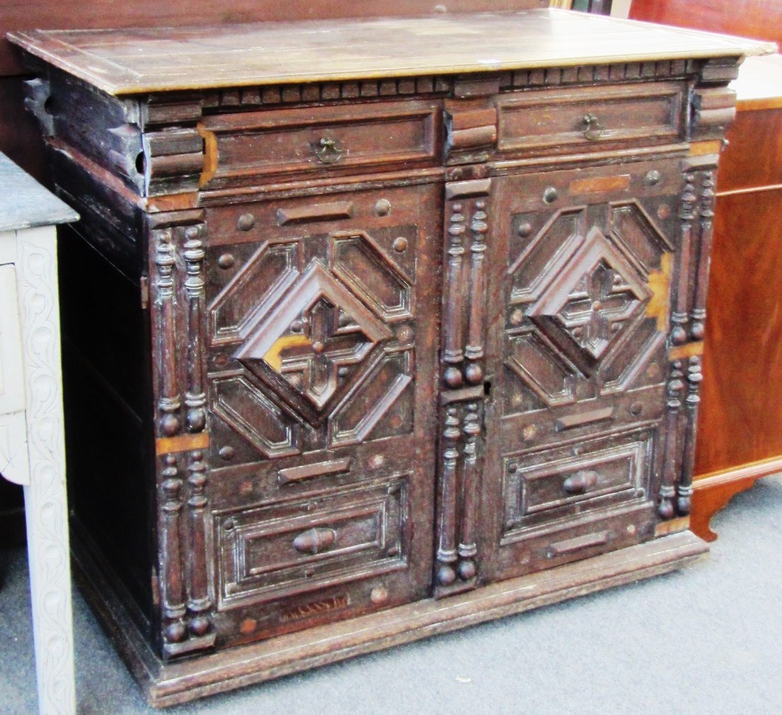 Appraisal: A Charles II oak side cabinet with pair of drawers