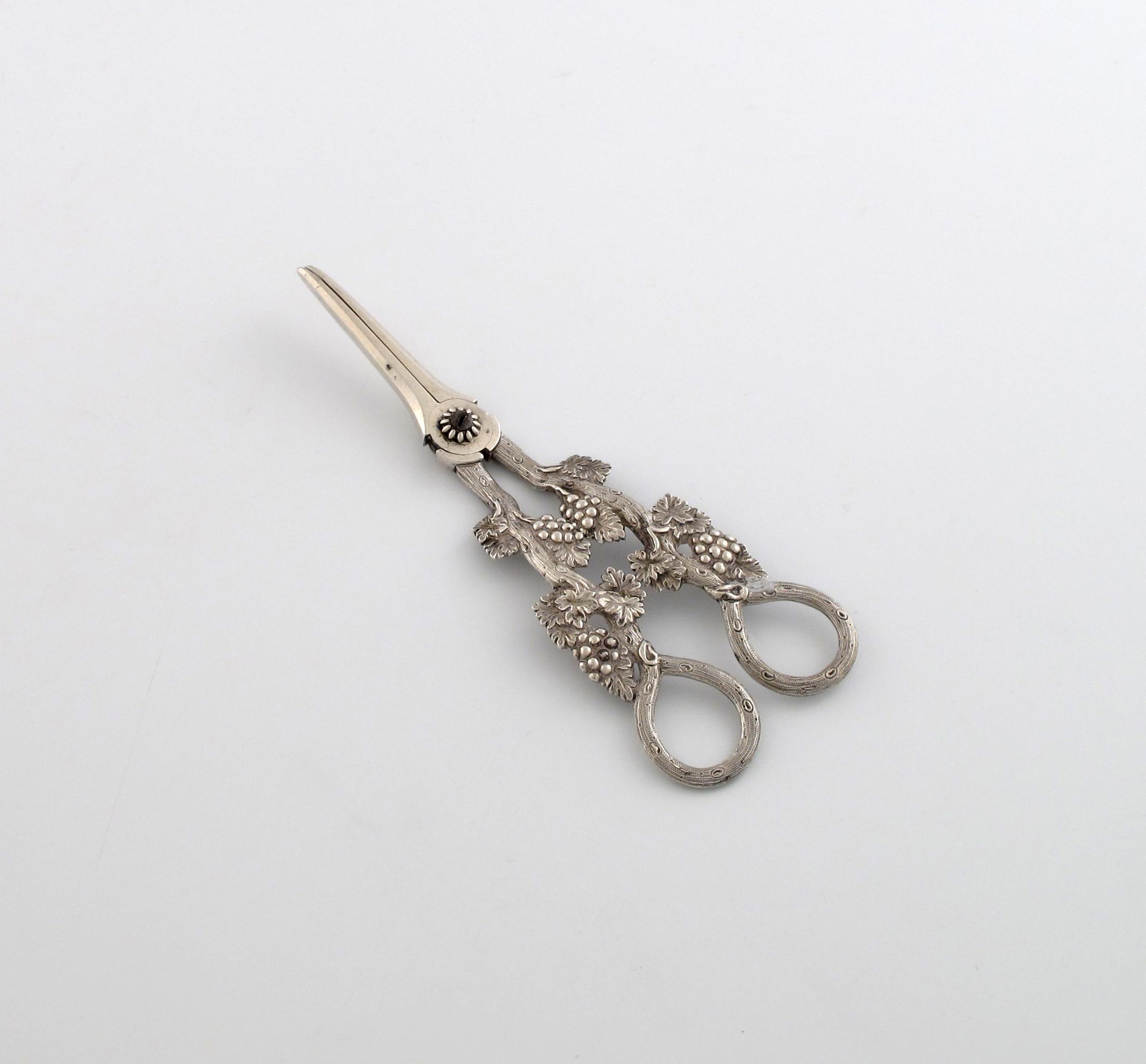 Appraisal: A pair of Victorian silver grape scissors