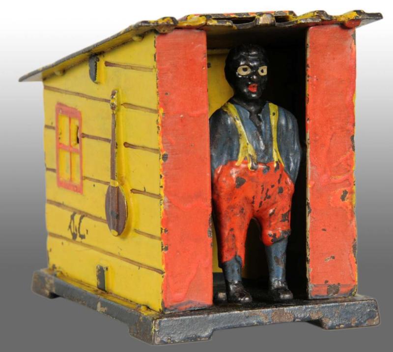 Appraisal: Cast Iron Cabin Mechanical Bank Description Manufactured by J E