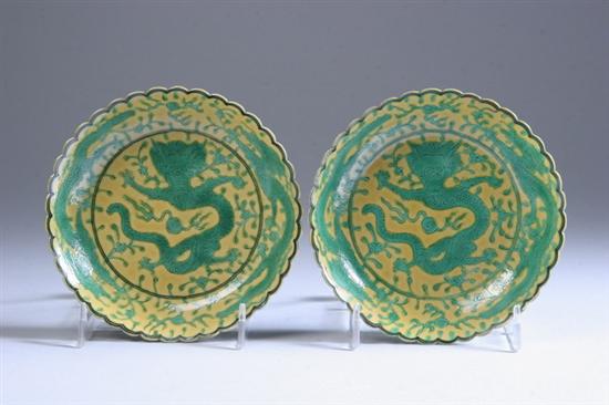 Appraisal: PAIR CHINESE IMPERIAL YELLOW AND GREEN DRAGON BOWLS Qianlong black