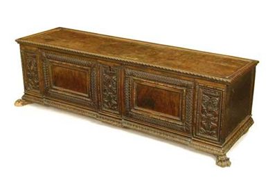 Appraisal: An Italian carved walnut cassone the hinged lid to a