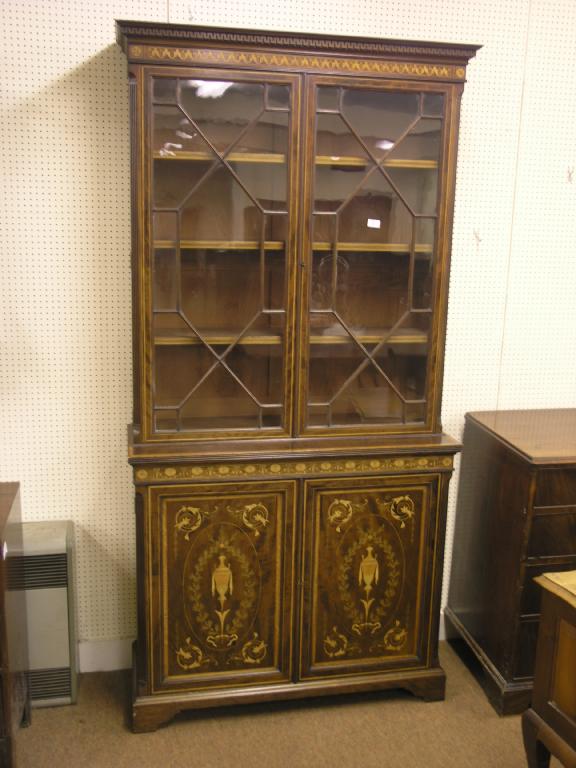 Appraisal: A good quality late Victorian inlaid mahogany bookcase elaborate inlay