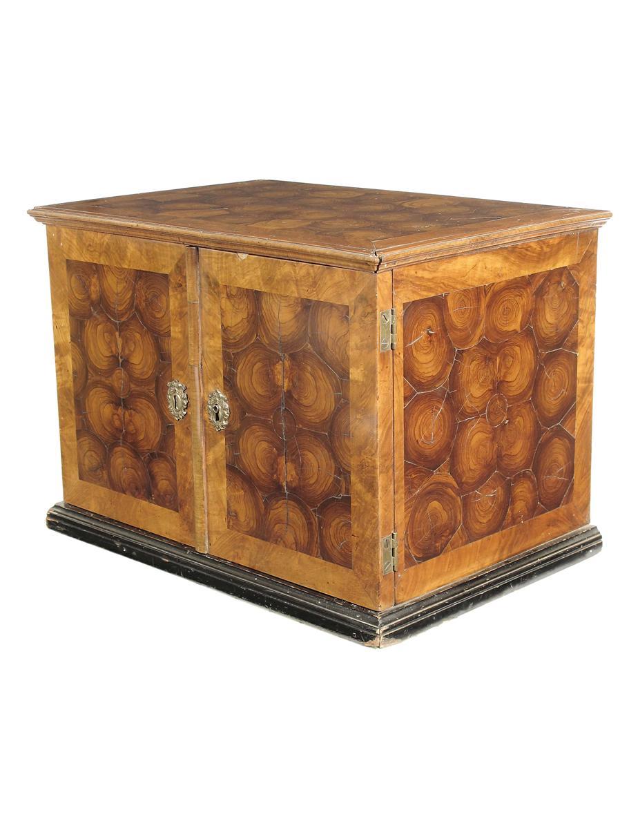 Appraisal: A walnut and oyster veneered table cabinet in William and