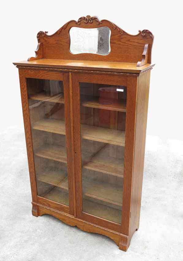 Appraisal: LARKIN OAK DOUBLE DOOR BOOKCASE Crest with applied carved decoration