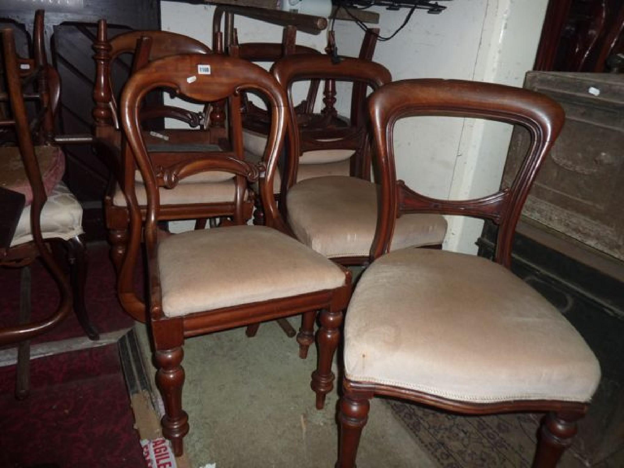 Appraisal: A set of four Victorian mahogany balloon back dining chairs