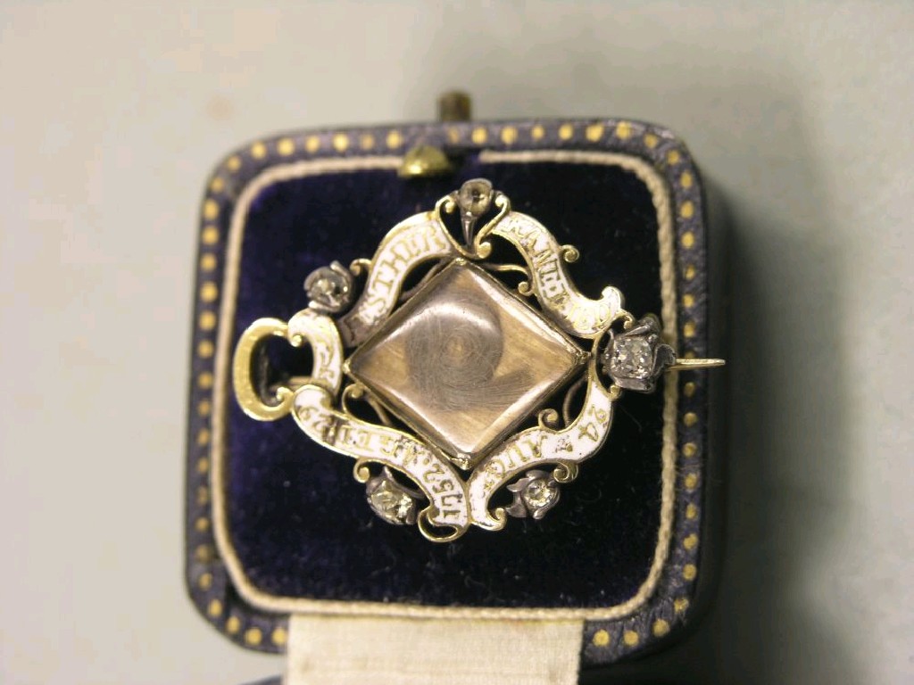 Appraisal: An enamelled mourning brooch with central inset hair locket small