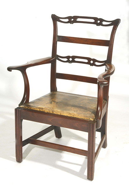 Appraisal: AN TH CENTURY MAHOGANY ELBOW CHAIR with open carved horizontal