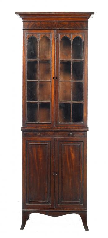 Appraisal: A GEORGE IV MAHOGANY BOOKCASE with stepped cavetto cornice fitted