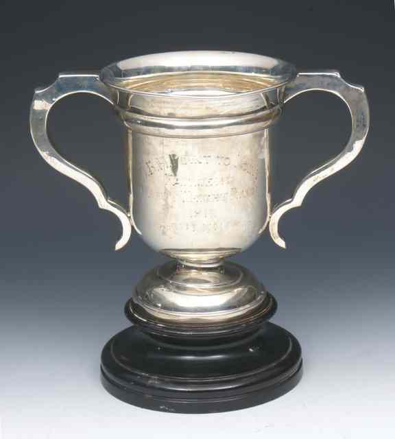 Appraisal: A TWO HANDLED SILVER TROPHY with a flared bowl and