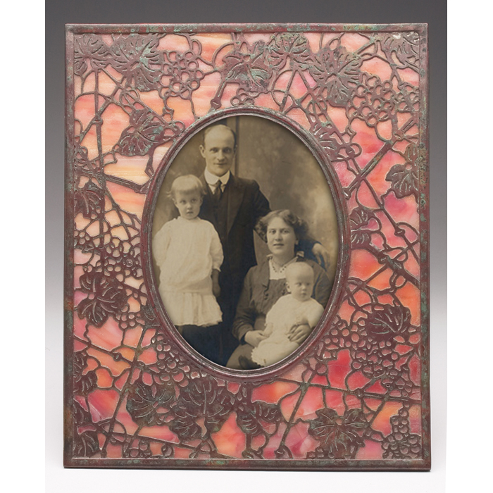 Appraisal: Tiffany Studios frame bronze in thegrapevine pattern over red and