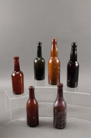 Appraisal: Assortment of Six Brown Glass Bottles Including Hoster Reynolds Kumyss