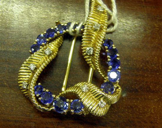 Appraisal: A SAPPHIRE AND DIAMOND SET GOLD CIRCULAR OPENWORK BROOCH