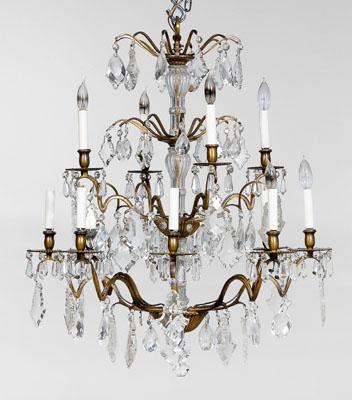 Appraisal: Italian brass and crystal chandelier lights glass-clad stem issuing two