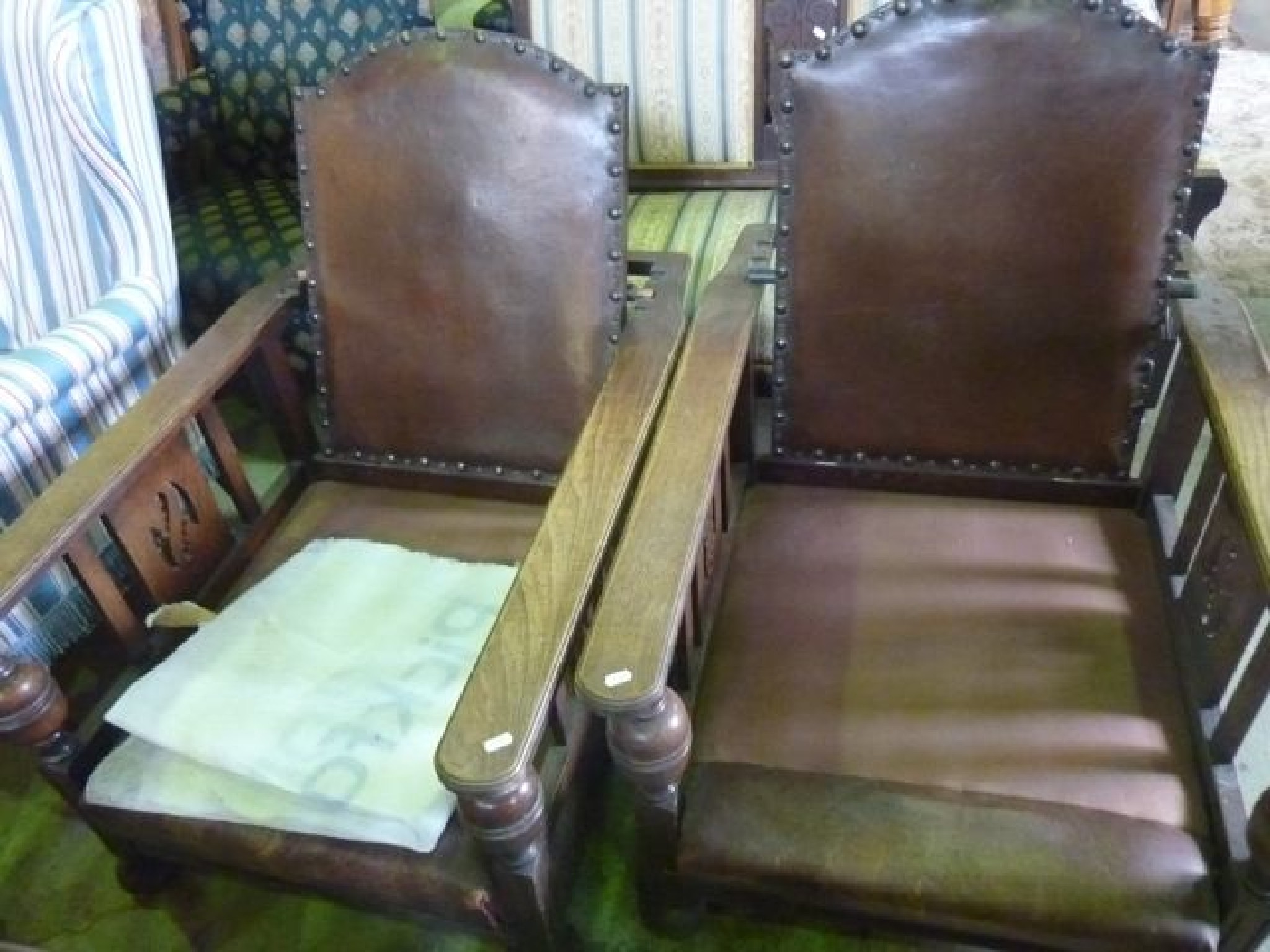 Appraisal: A pair of s oak low deep seated lounge chairs