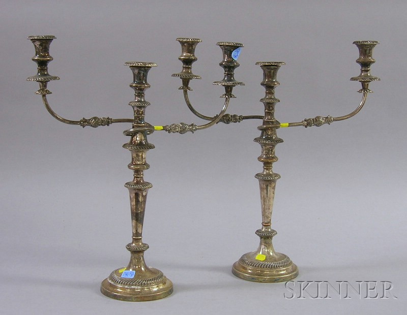 Appraisal: Pair of Weighted Silver Plated Convertible Three-Light Candelabra ht approx