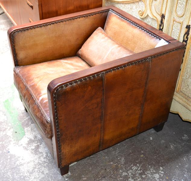 Appraisal: AN ART DECO STYLE HARDWOOD AND LEATHER CLUB ARMCHAIR the