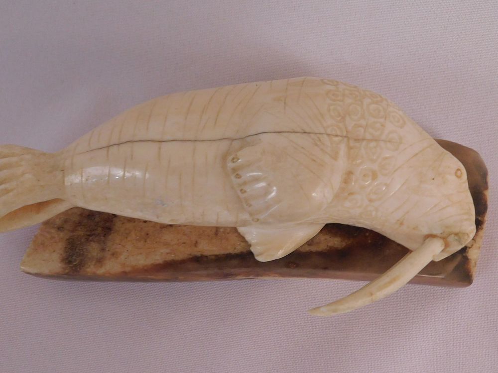 Appraisal: WALRUS FIGURINE BY WONGITTILIN Inuit carved walrus tusk in the