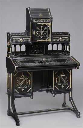 Appraisal: AMERICAN GILT-METAL-MOUNTED EBONIZED SLANT-FRONT DESK IN THE REFORMED GOTHIC-STYLE The