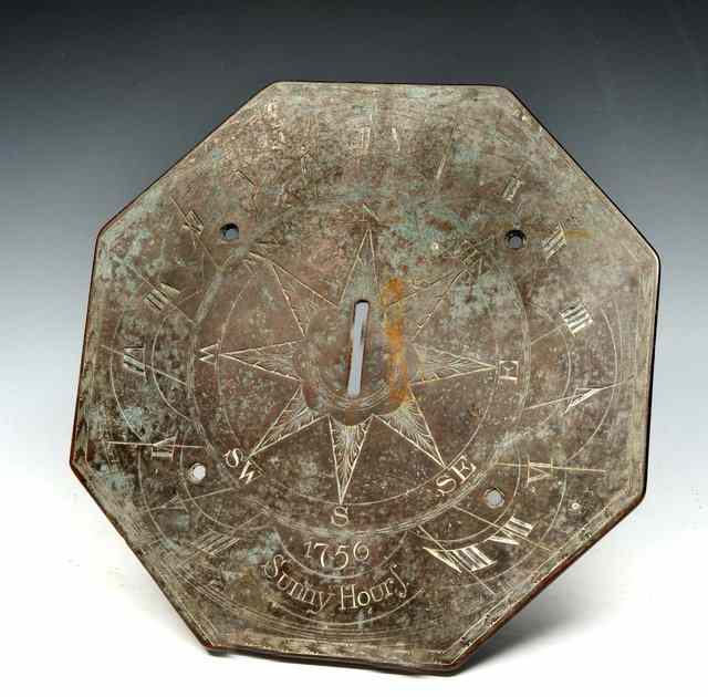 Appraisal: AN ANTIQUE BRASS OCTAGONAL SUN DIAL PLATE decoratively engraved and