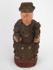 Appraisal: A Chinese carved and painted wood figure of a seated